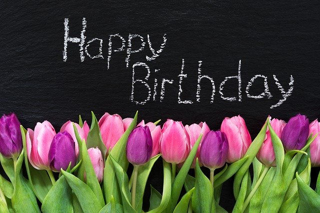 Happy_Birthday_Sign_with_Pink_and_Purple_Tulip__Flowers